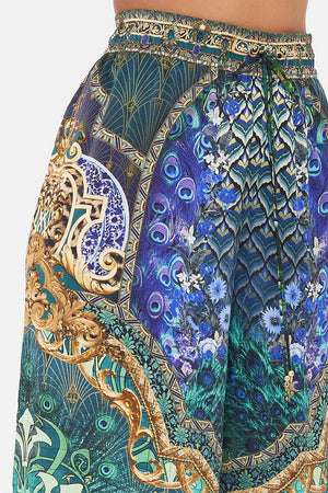 Detail view of model wearing CAMILLA silk pants in Fan Dance print 