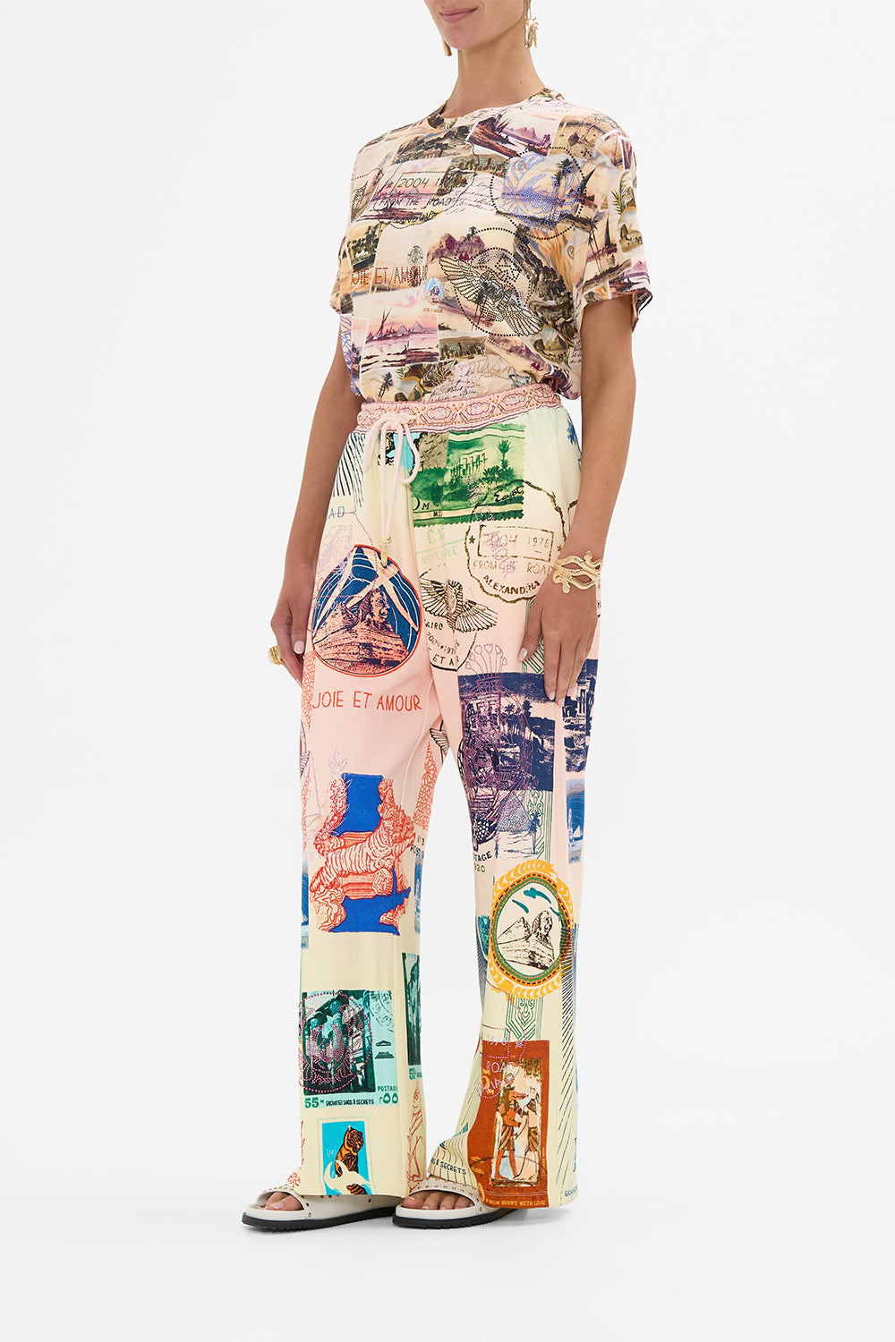 CAMILLA blush straight leg track pant in Haute Passport print. 