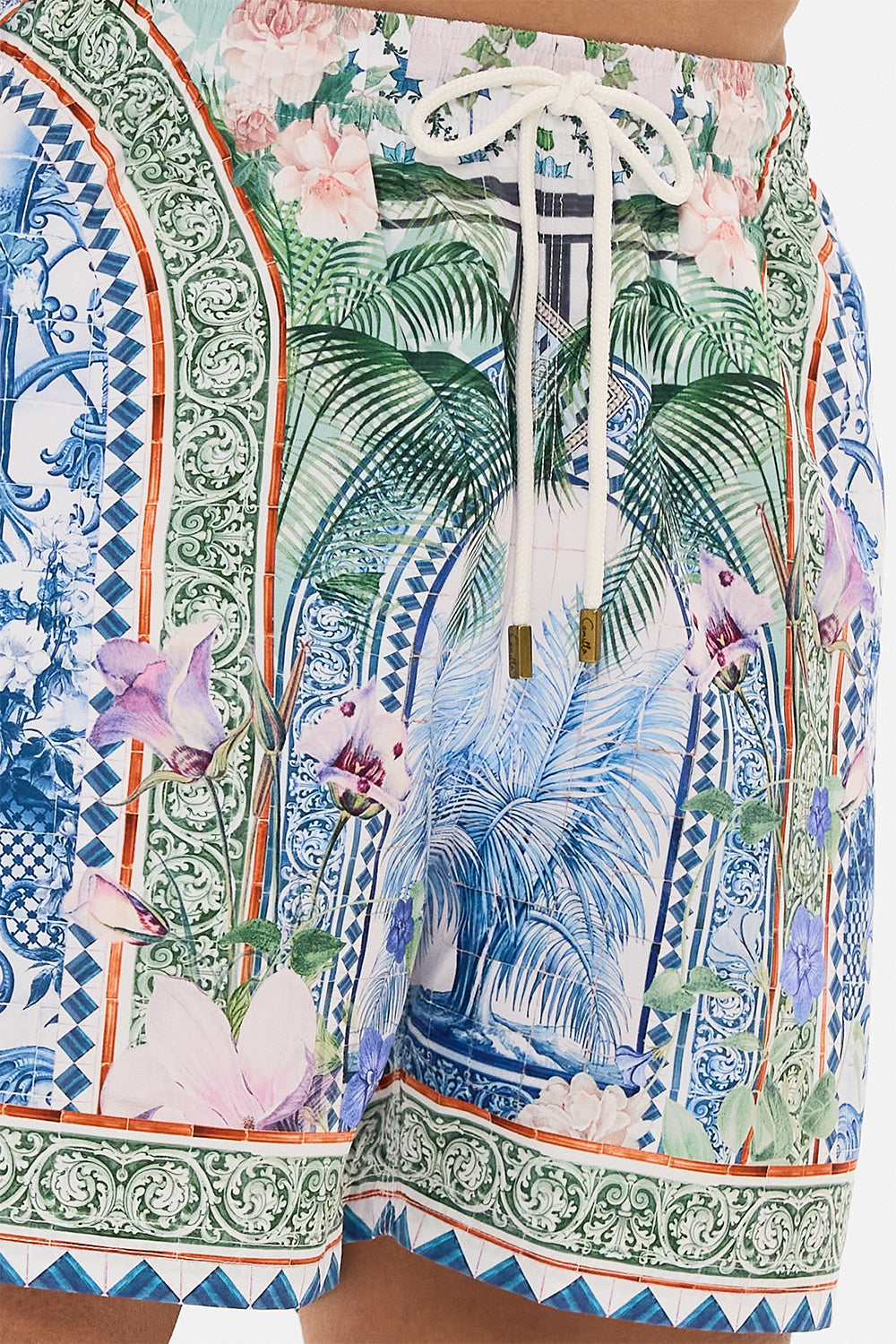 The CAMILLA MID LENGTH BOARDSHORT JARDIM PARTY in our  print.
