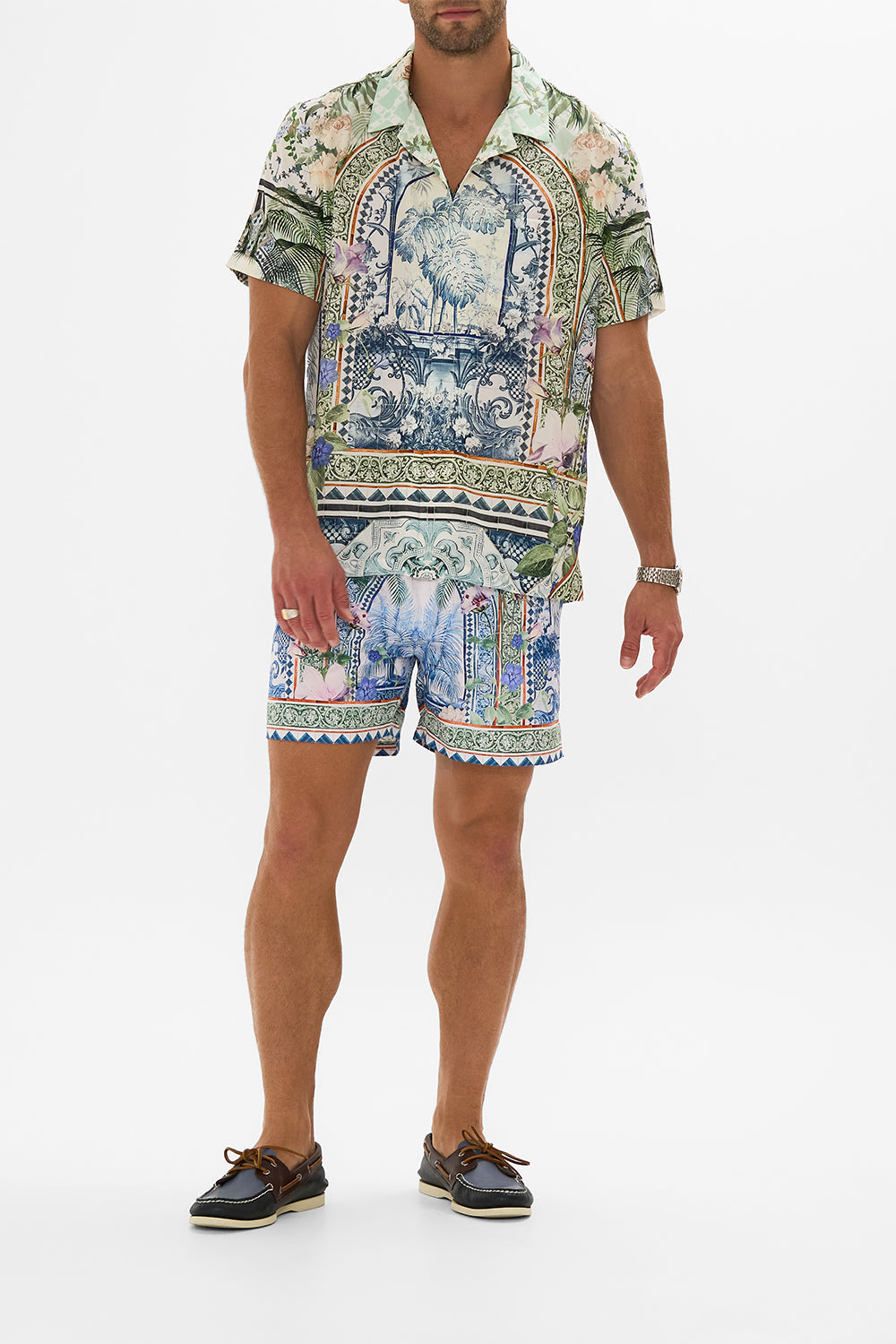 The CAMILLA MID LENGTH BOARDSHORT JARDIM PARTY in our JARDIM PARTY print.