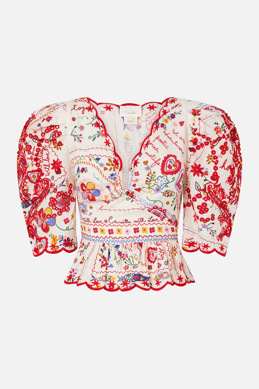 TOP CON MANGAS ABULLONADAS Y APLIQUES UN KITSCH A TIEMPO