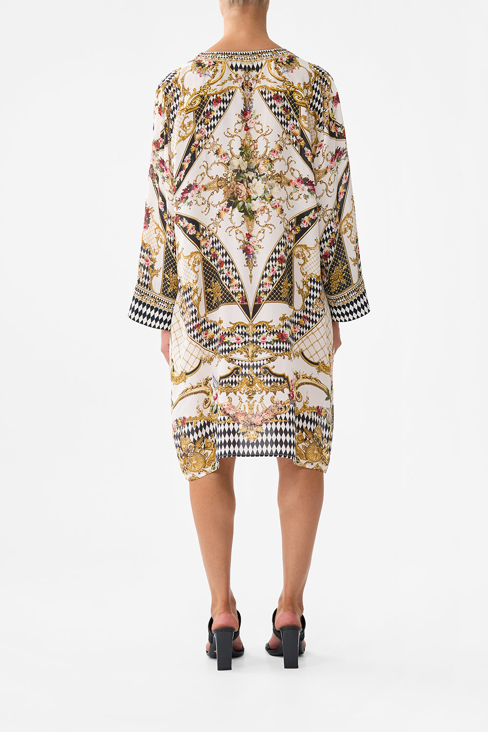 The CAMILLA METAL EYELET KAFTAN ROCOCO GLOW in our  print.
