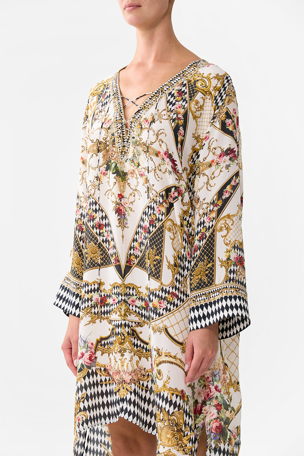 The CAMILLA METAL EYELET KAFTAN ROCOCO GLOW in our  print.
