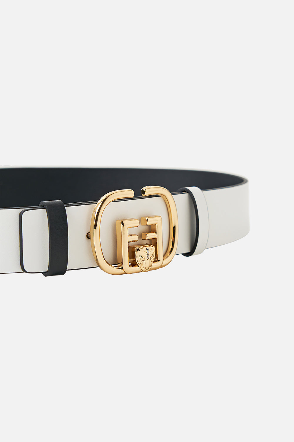 The CAMILLA REVERSIBLE MONOGRAM BUCKLE BELT SOLID WHITE in our  print.
