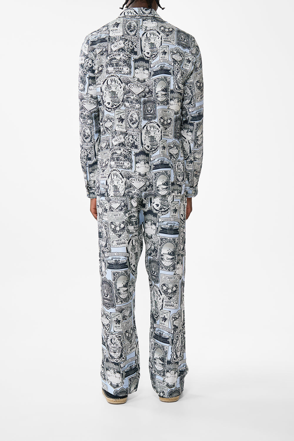 The CAMILLA LONG SLEEVE CAMP COLLARED SHIRT FLOWER SHOWERS in our  print.