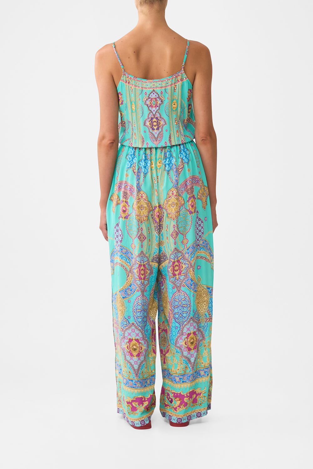 The CAMILLA shoestring strap jumpsuit from our print the concubines corridor