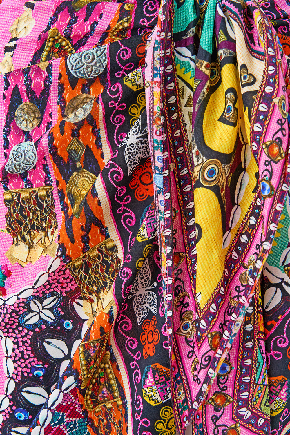 The CAMILLA woven short sarong with tassels from our print patchwork panorama