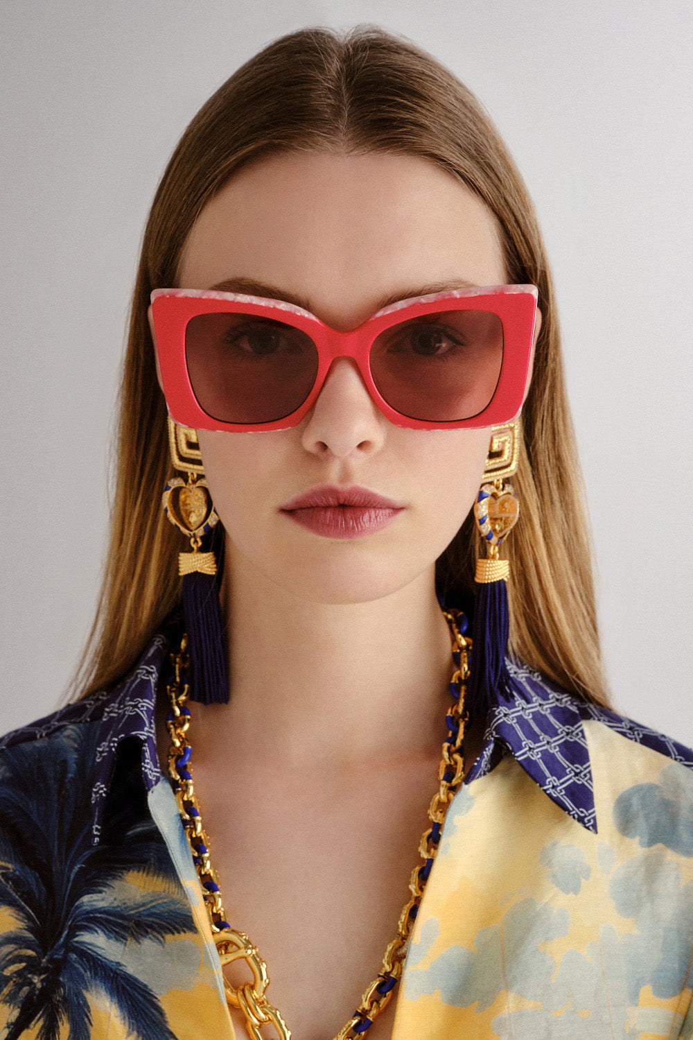 The CAMILLA WHERE'S MY VALET SUNGLASSES SOLID POPPY / IVORY MARBLE GOLD in our  print.
