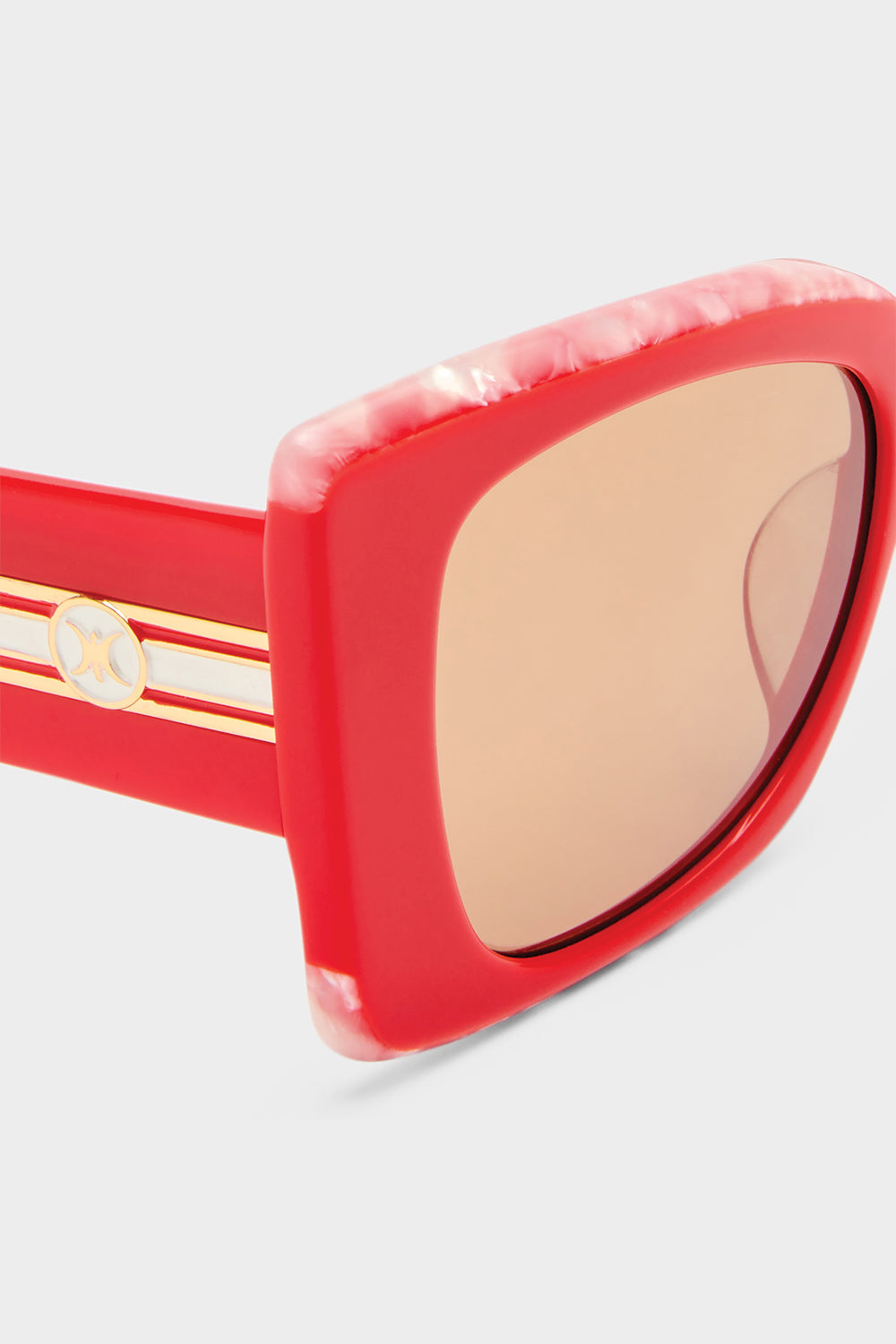 The CAMILLA WHERE'S MY VALET SUNGLASSES SOLID POPPY / IVORY MARBLE GOLD in our  print.