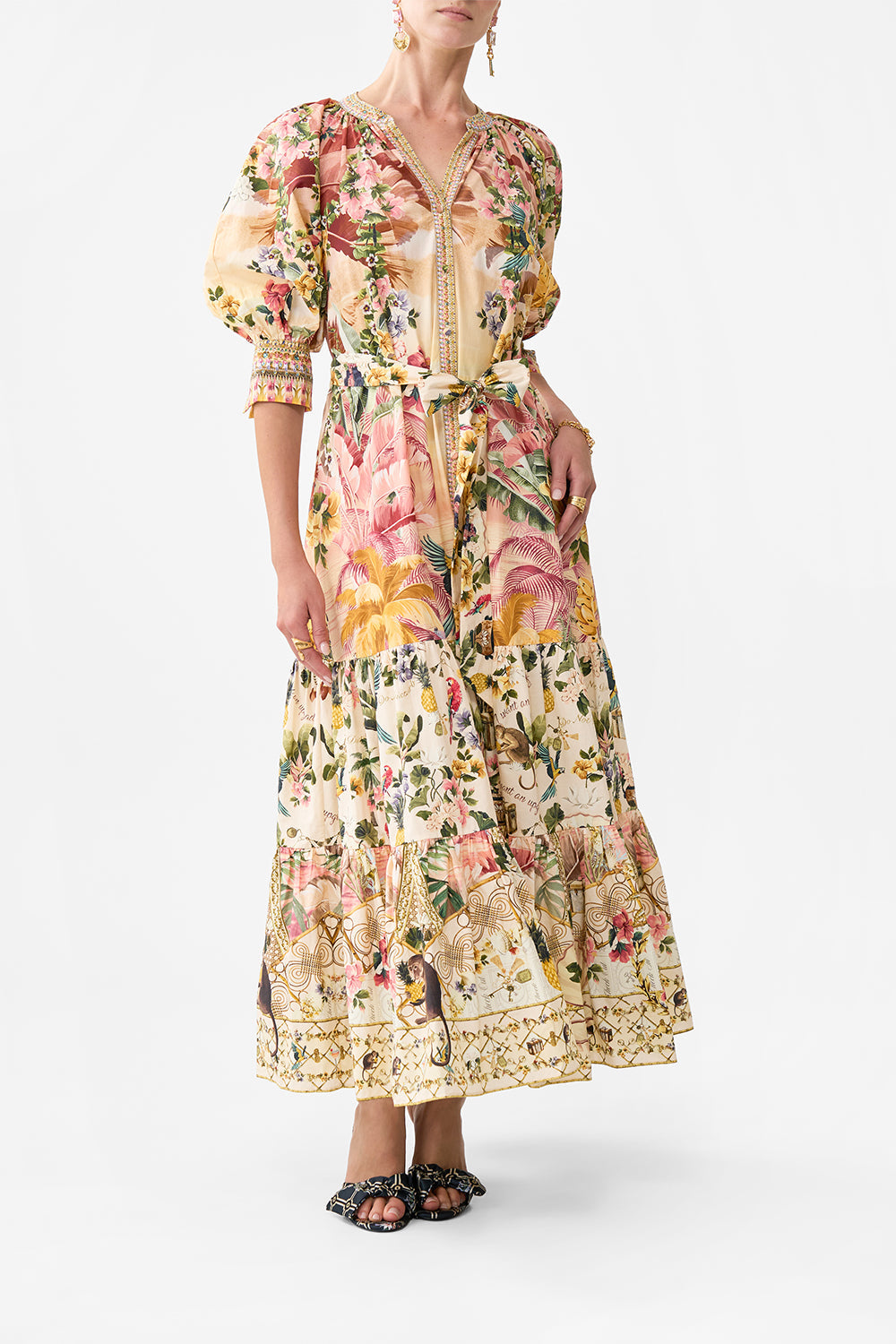 The CAMILLA TIERED SHIRT DRESS WITH SHORT SLEEVE WELCOME TO THE WHITE LOTUS in our WELCOME TO THE WHITE LOTUS print.