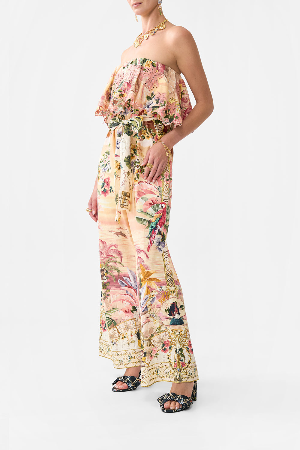 The CAMILLA STRAPLESS JUMPSUIT WITH FRILL WELCOME TO THE WHITE LOTUS in our  print.