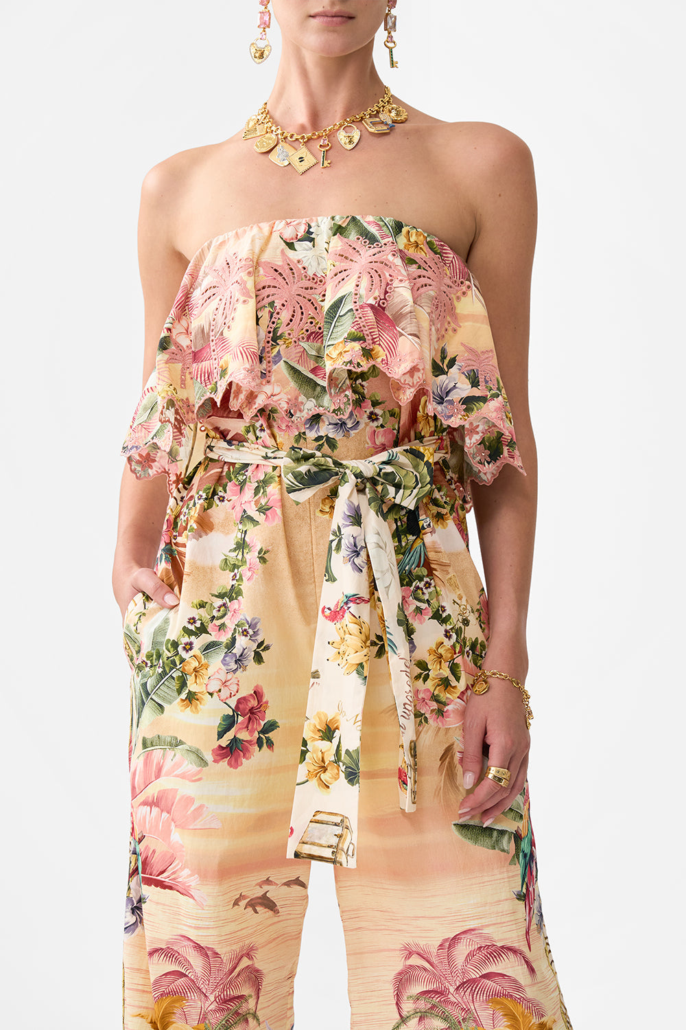 The CAMILLA STRAPLESS JUMPSUIT WITH FRILL WELCOME TO THE WHITE LOTUS in our  print.