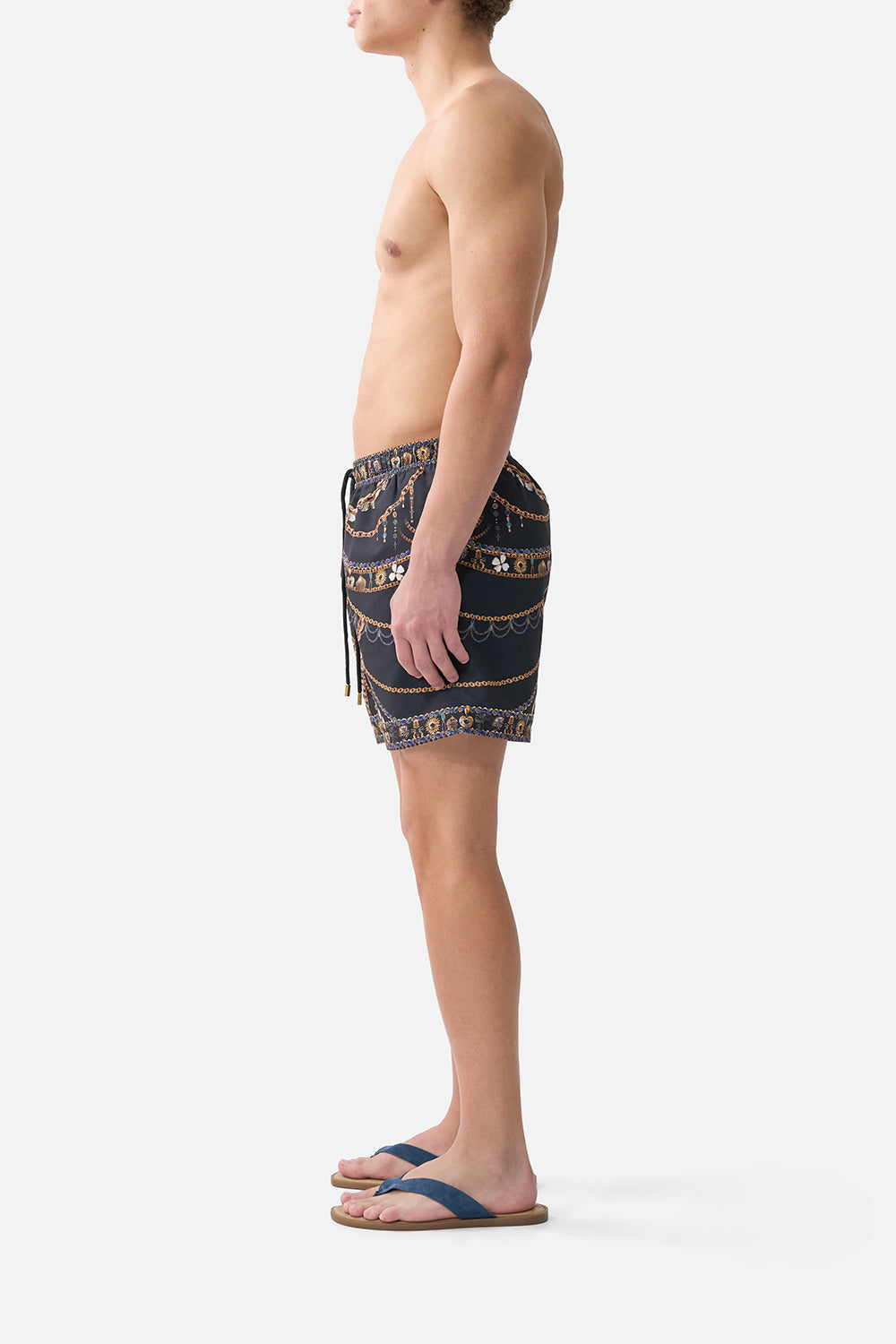 The CAMILLA mid length boardshort with elastic waist from our print amulets and alchemy, side model view