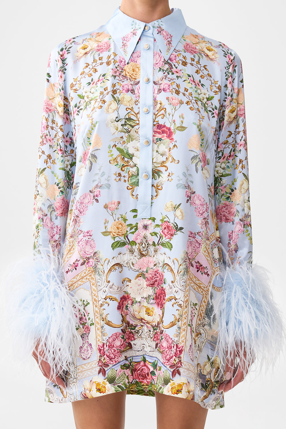 MINIVESTIDO CON PLUMAS EN LOS AZULEJOS DEL TIEMPO