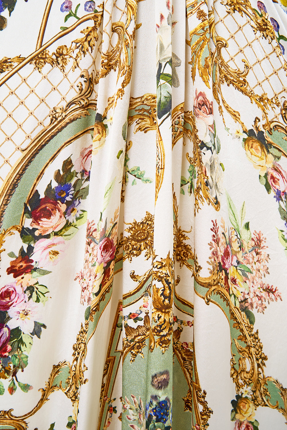 The CAMILLA TWIST FRONT BATWING DRESS DRESSING ROOM DRAMA in our  print.