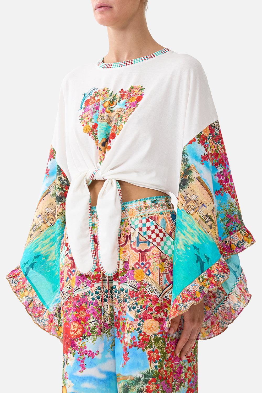 The CAMILLA tie front ruffle sleeve t shirt in our print Meet Me in Mallorca.