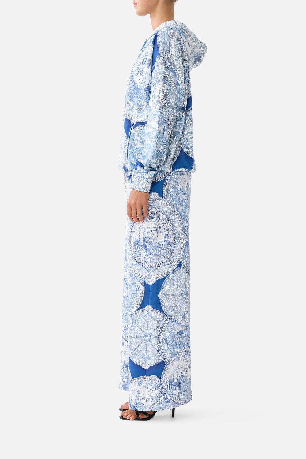 The CAMILLA contrast band hoodie with side pockets in our print De Nada Granada. Side model view.