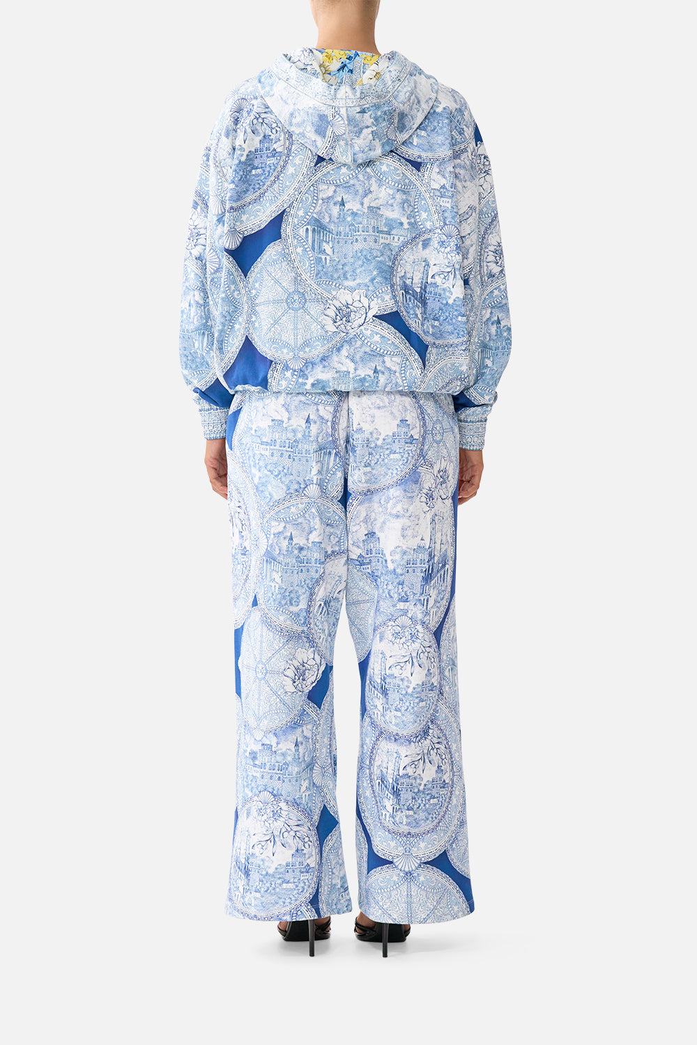 The CAMILLA contrast band hoodie with side pockets in our print De Nada Granada. Back model view.