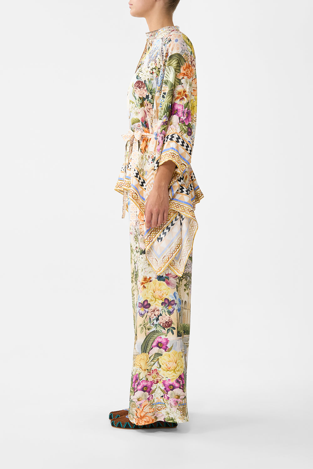 The CAMILLA button through scarf blouse in our print The Architects of Alcázar. Side model view.