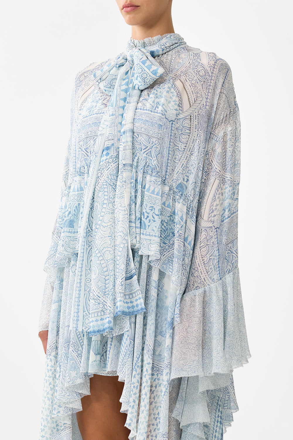 The CAMILLA RUFFLE HIGH LOW DRESS WITH LONG SLEEVE THE HUM OF THE ALHAMBRA in our  print.
