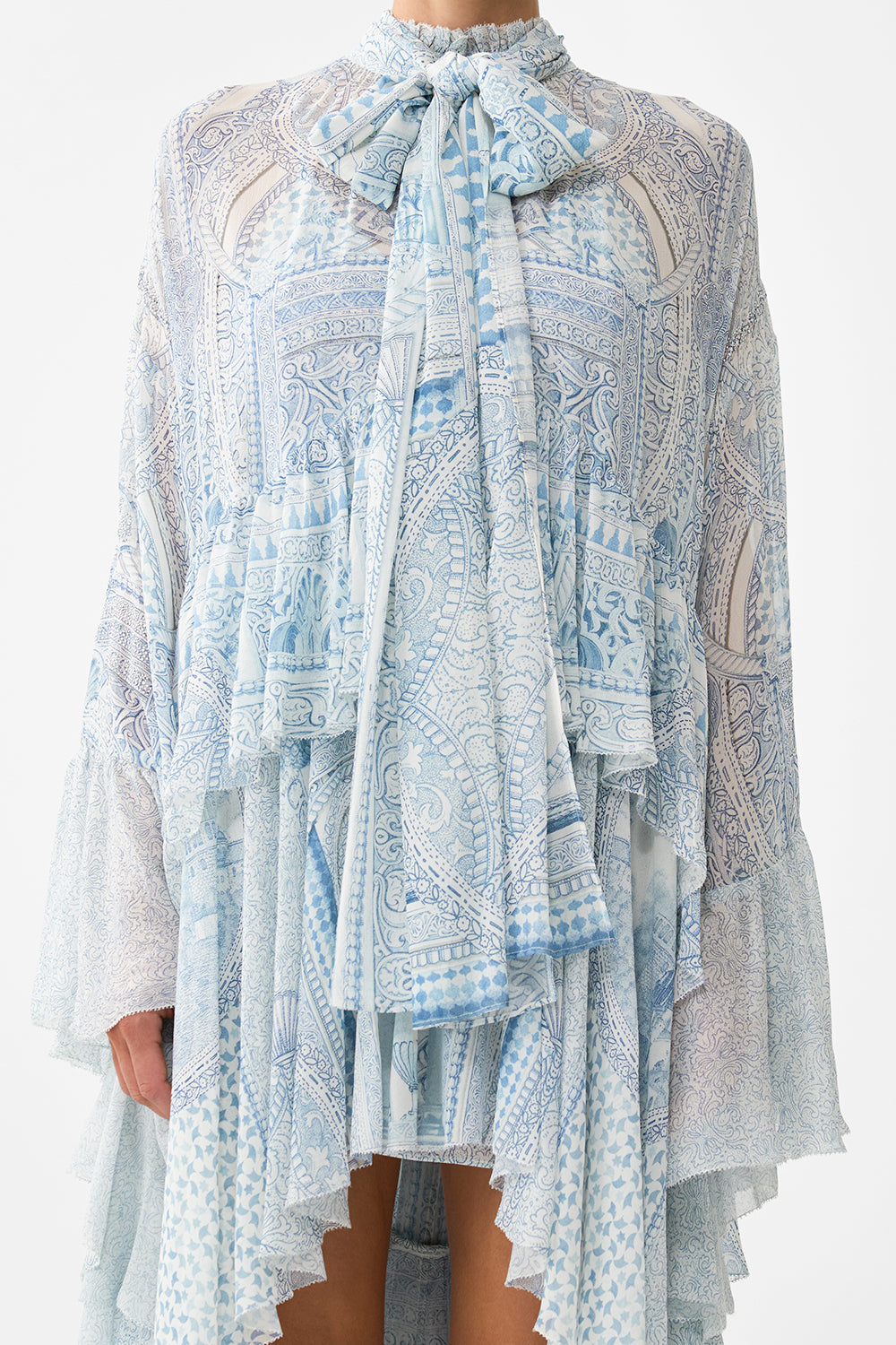 The CAMILLA RUFFLE HIGH LOW DRESS WITH LONG SLEEVE THE HUM OF THE ALHAMBRA in our  print.