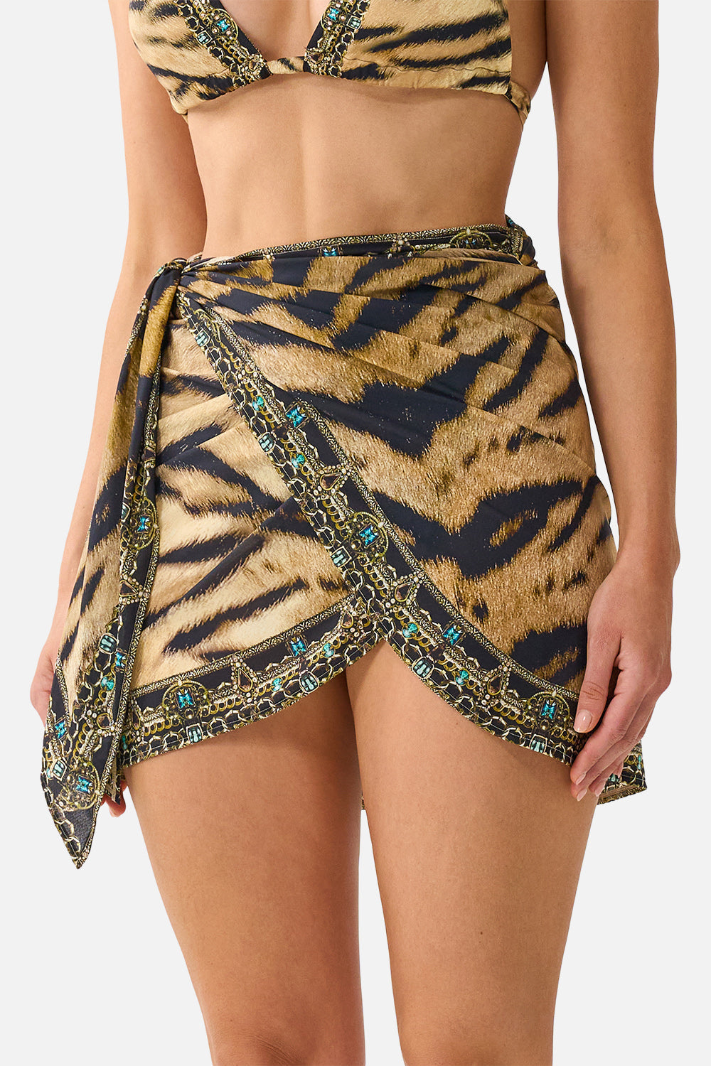 The CAMILLA Eyelet Wrap Mini Sarong W/ Tie Waist in Print A Wink to the Wild. Model View