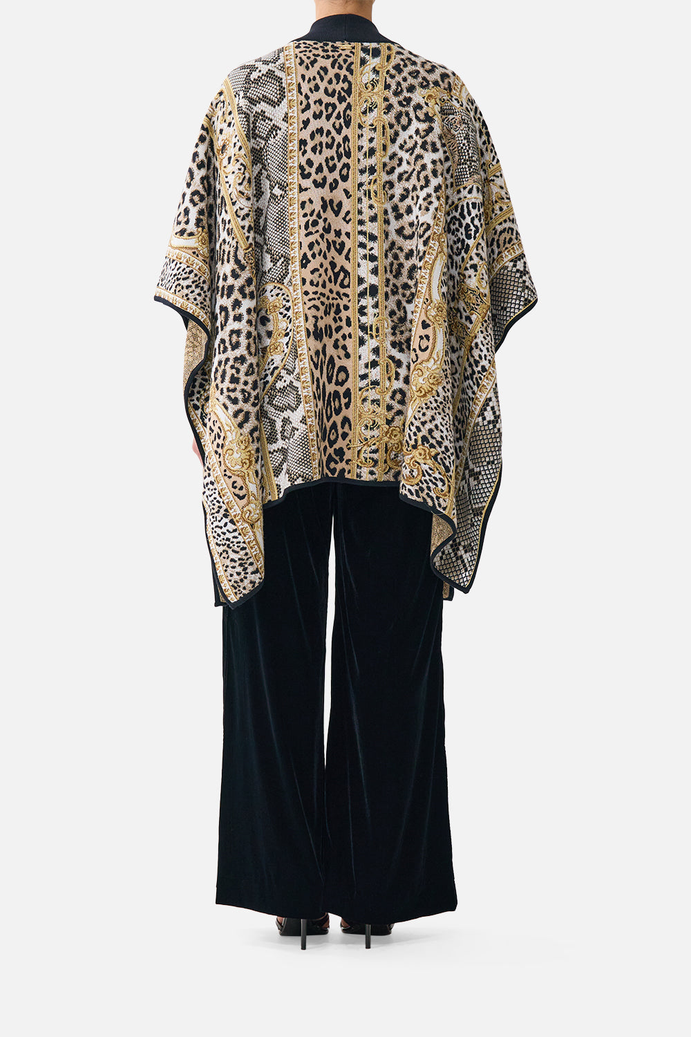 The CAMILLA Funnel Neck Drape Knit Poncho Leopard Libertine in our Leopard Libertine print.