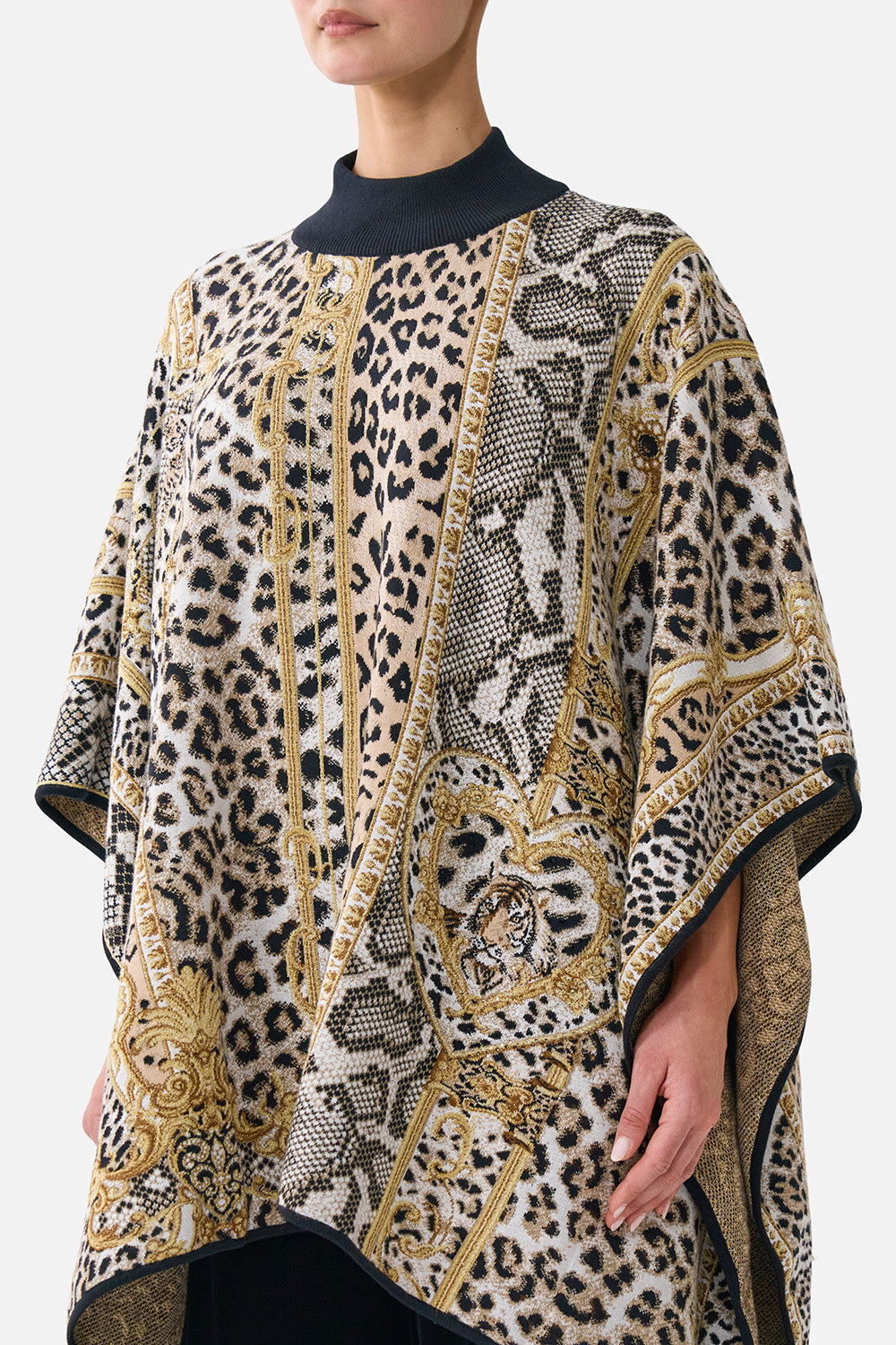 The CAMILLA Funnel Neck Drape Knit Poncho Leopard Libertine in our Leopard Libertine print.