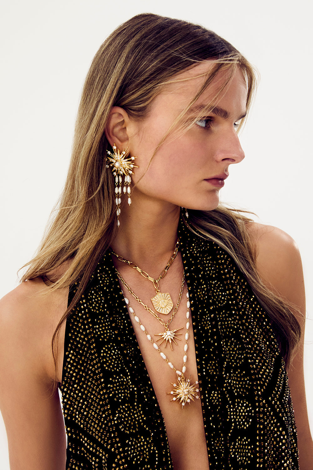 The CAMILLA Palais Aetheria Pendant Necklace in gold, worn on model.