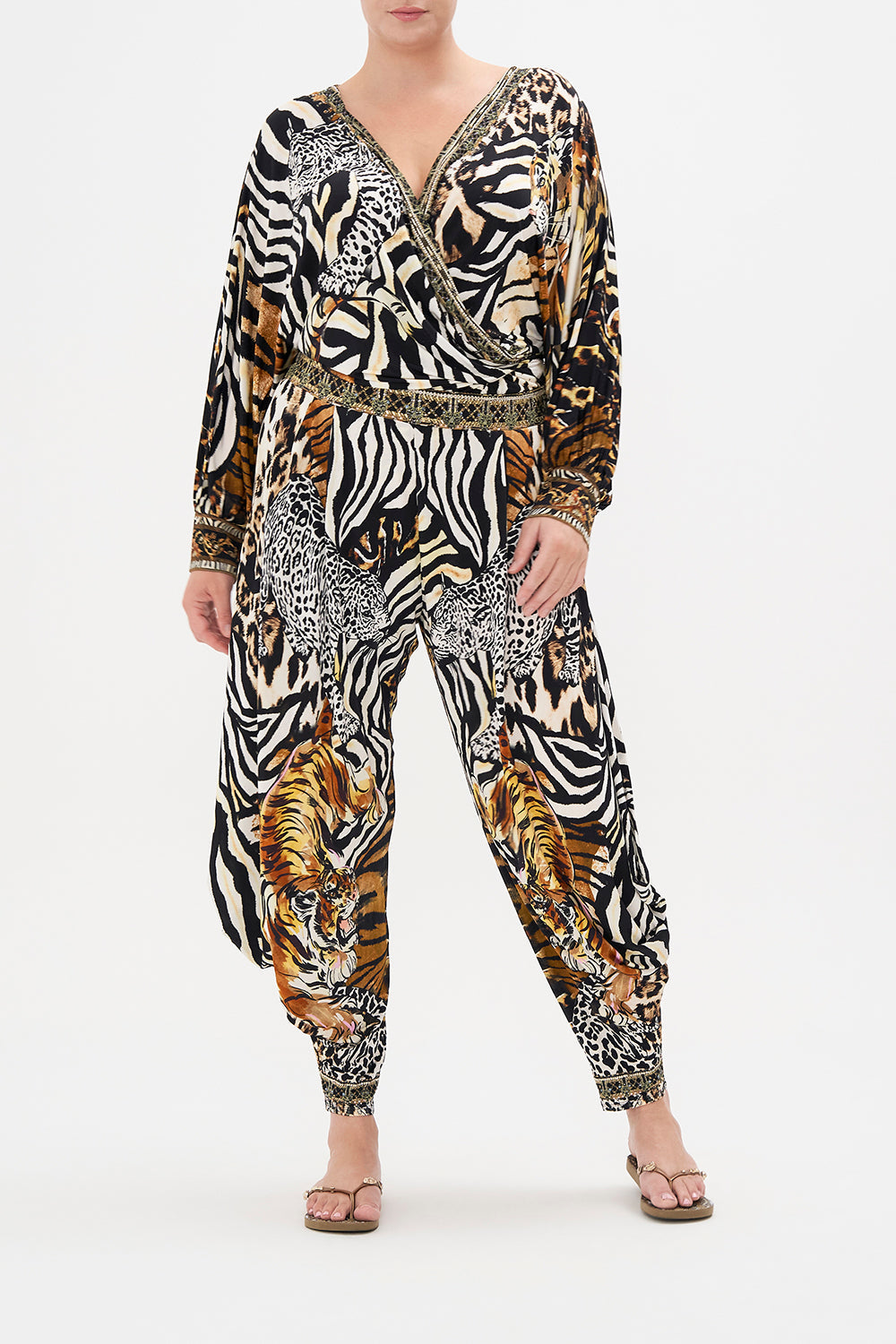 Front view of curvy model wearing CAMILLA plus size animal print jersey drop pant in What's New Pussycat print