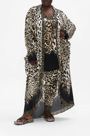 Front view of curvy model wearing CAMILLA plus size leopard print jacket in Cool For Cats print