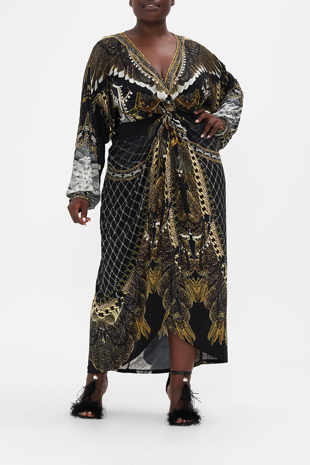 Front view of curvy model wearing CAMILLA plus size black maxi dress in Ravin Raven print